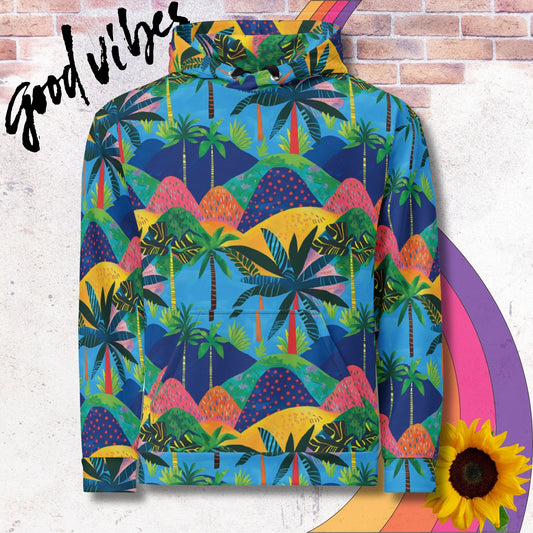 All over print unisex hoodie. Tropical island vibes, colorful blue, yellow, pink pattern of hills with palm trees