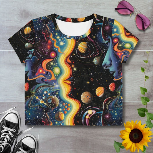 Women's all over print cropped t-shirt. Psychedelic space theme design with colorful planets and stars, an orange galaxy swirls across space