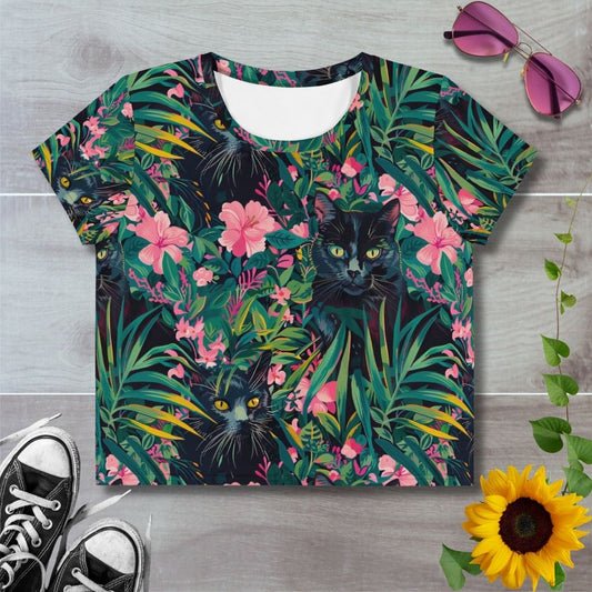 Women's all over print cropped t-shirt. Black cats amongst green foliage and pink flowers