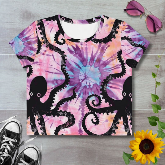 Women's all over print cropped t-shirt. Pink tie dye with black octopus silhouette, tentacles spiralling around the t-shirt