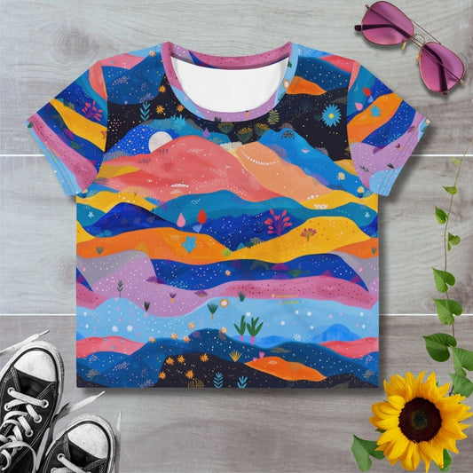 Women's all over print cropped t-shirt. Layered blues and oranges, hills and waves under starry sky