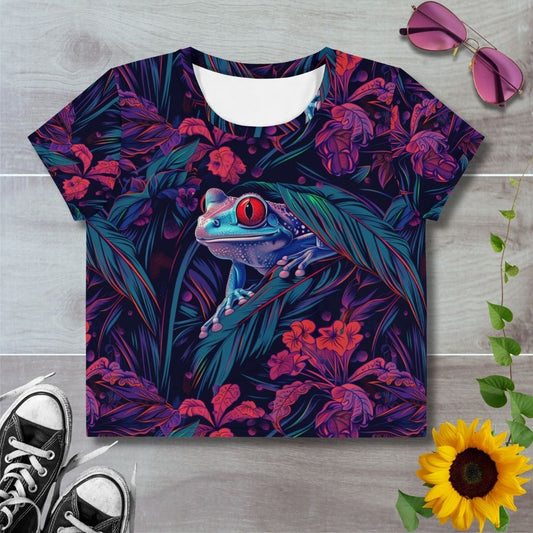 Women's all over print cropped t-shirt. Tree frog amongst red and green foliage 